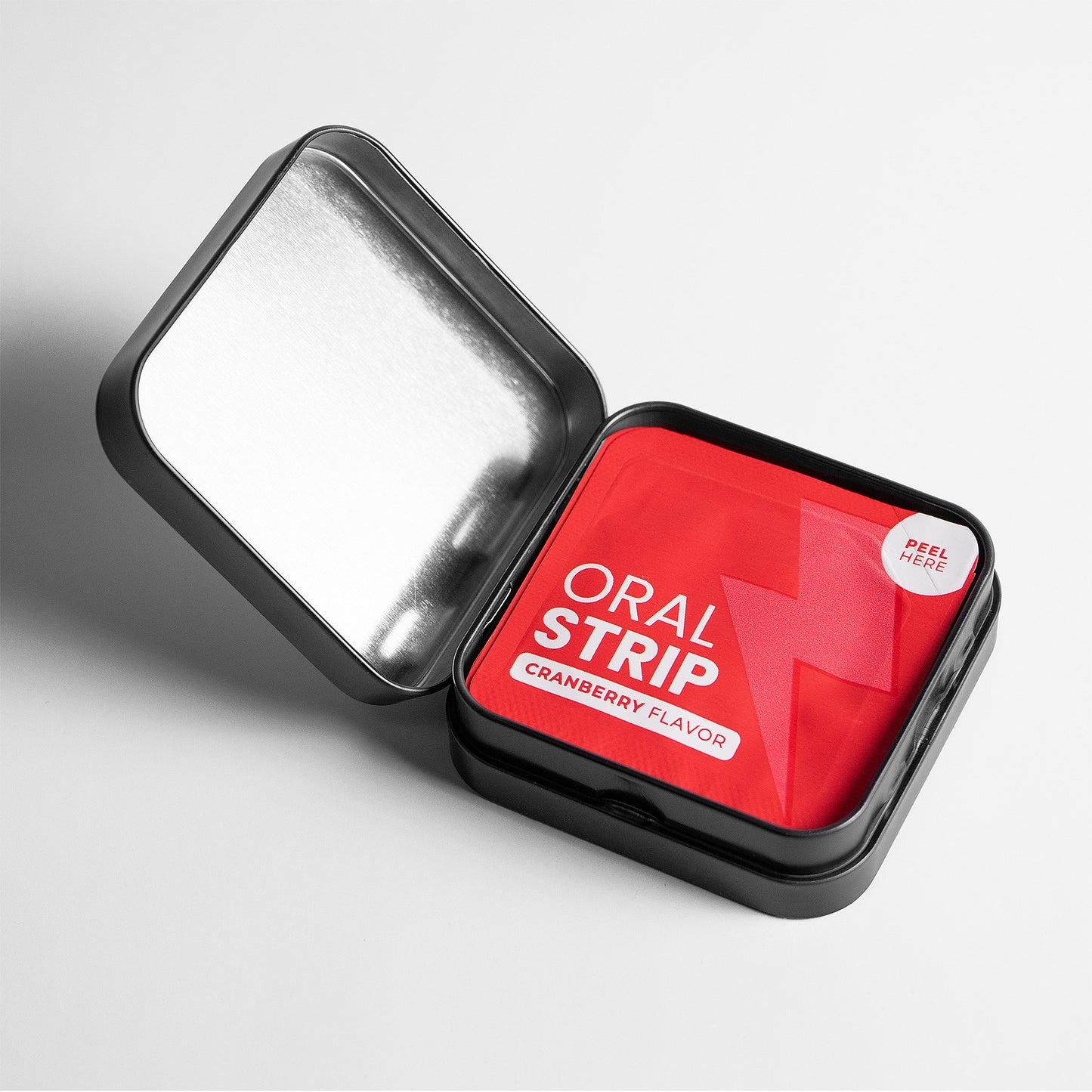 Red container with 'Oral Strip' packaging on a light gray background