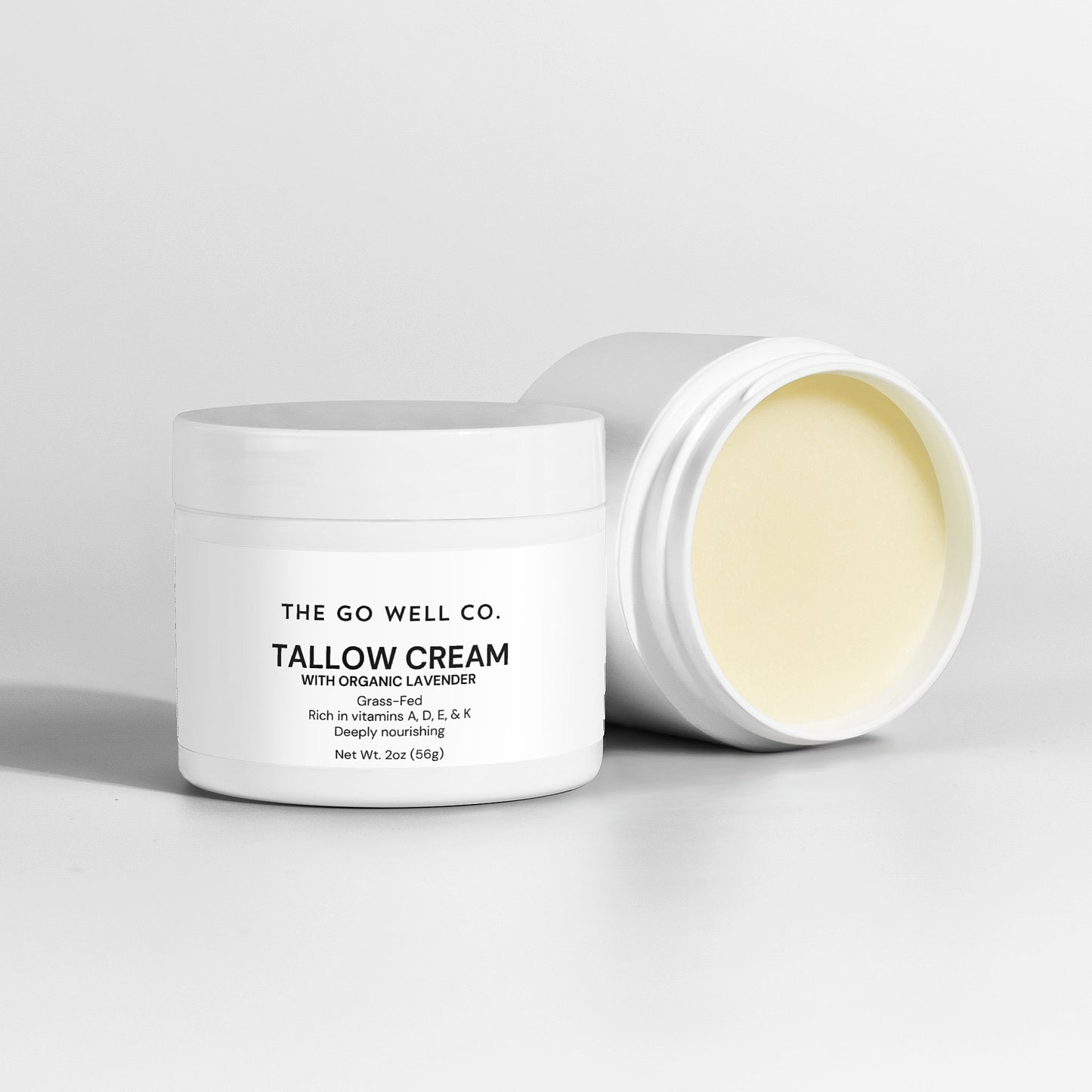 Tallow cream jar with 'The Go Well Co.' branding on a light gray background