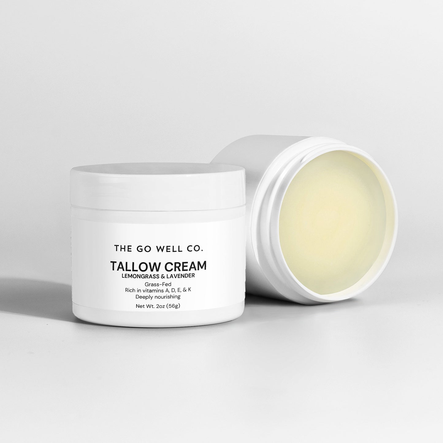 Tallow cream jar with 'The Go Well Co.' branding on a light gray background