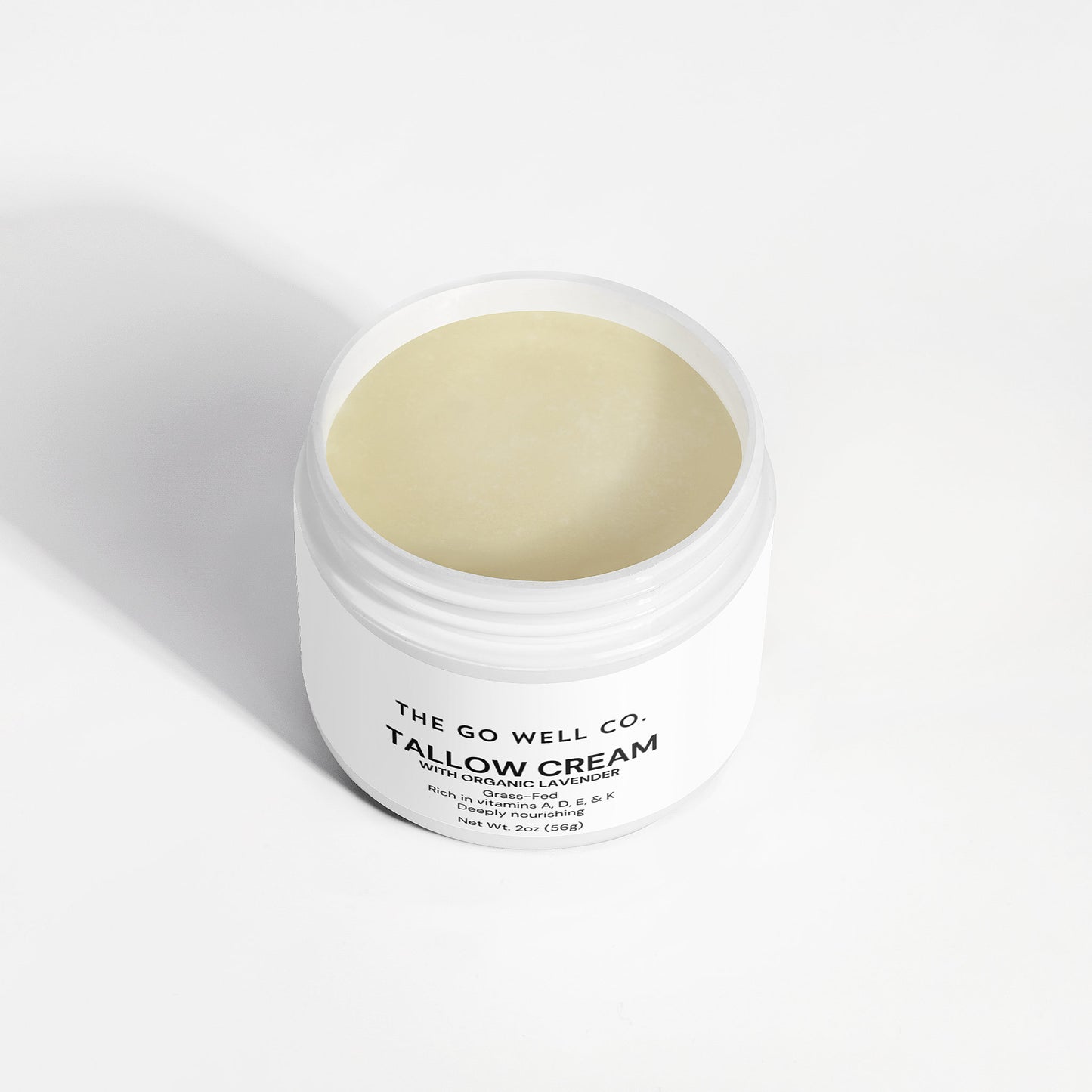 Jar of tallow cream from The Go Well Co. on a white background
