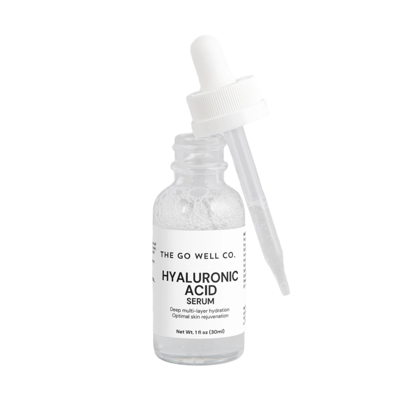 Hyaluronic acid serum bottle with dropper labeled 'The Go Well Co.' on a light gray background