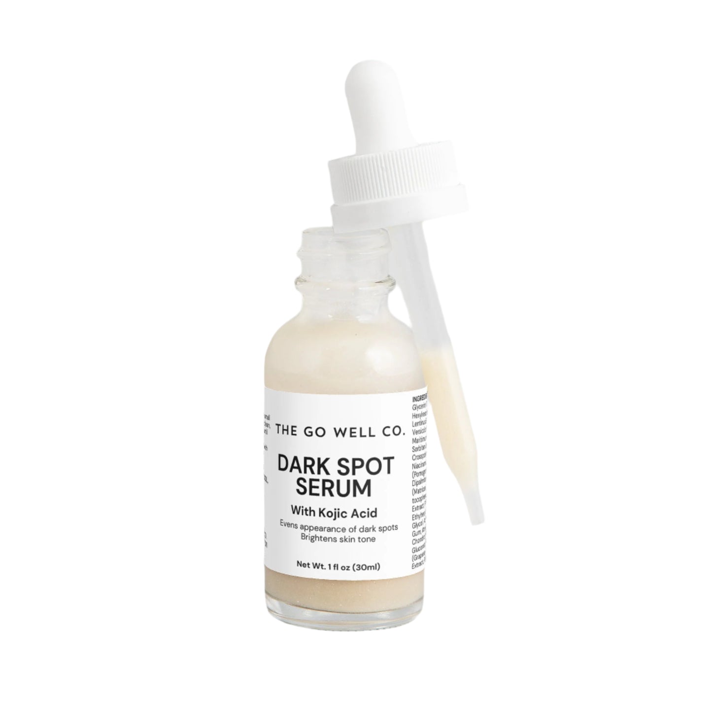 Dark spot serum bottle with dropper labeled 'The Go Well Co.' on a white background