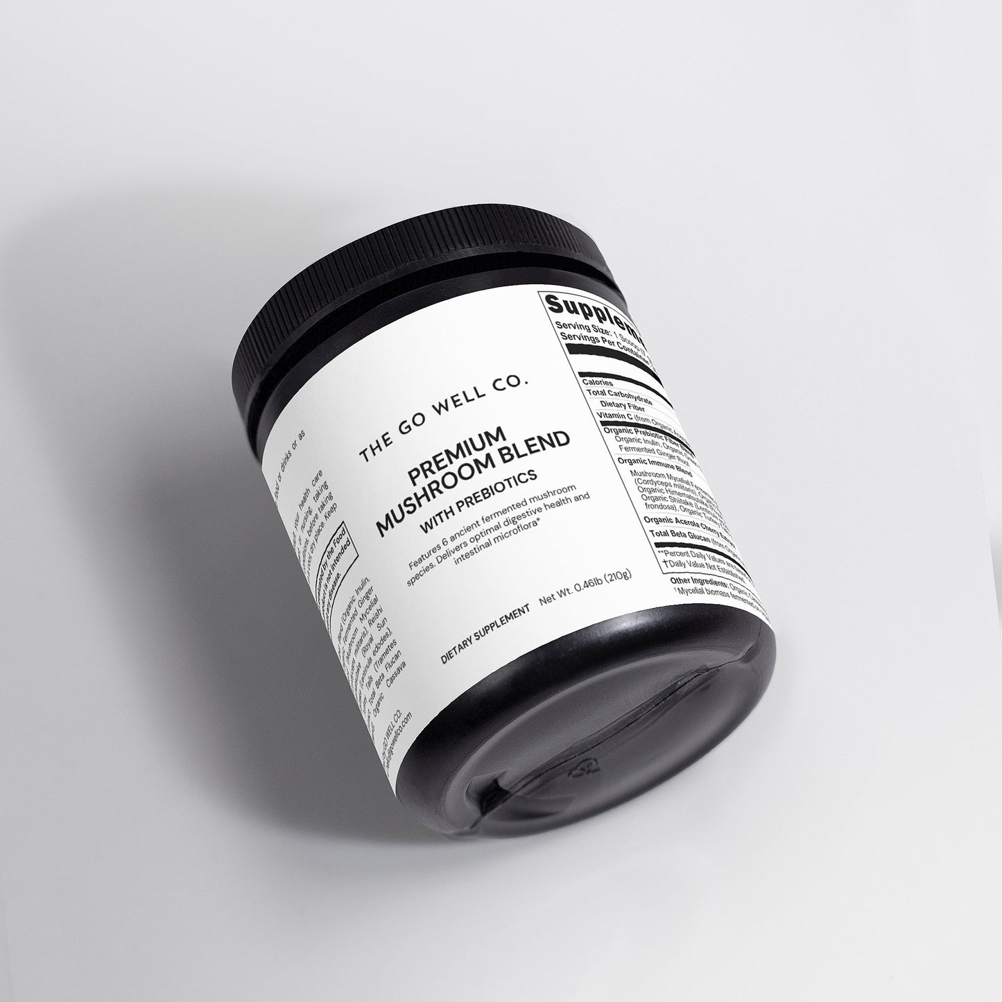 Container of 'The Go Well Co.' premium mushroom blend with prebiotics on a gray background