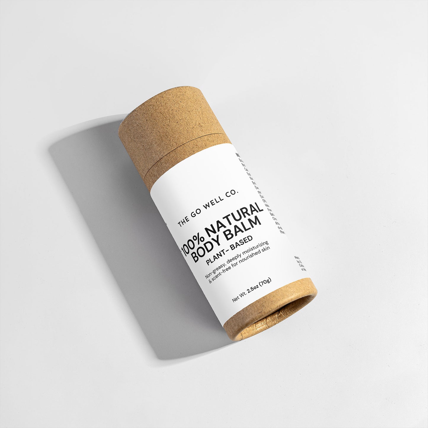 Roll-up natural body balm with cork lid on a light gray background