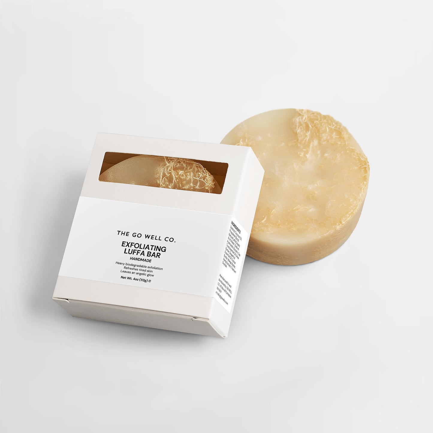 Exfoliating loofa bar from The Go Well Co. on a light gray background