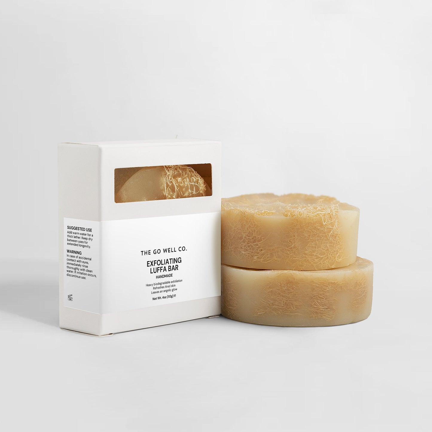 Exfoliating Luffa Bar from The Go Well Co. with packaging on a white background