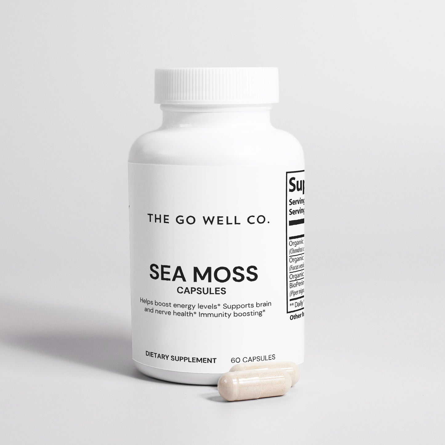 White bottle of Sea Moss capsules from The Go Well Co. on a light gray background