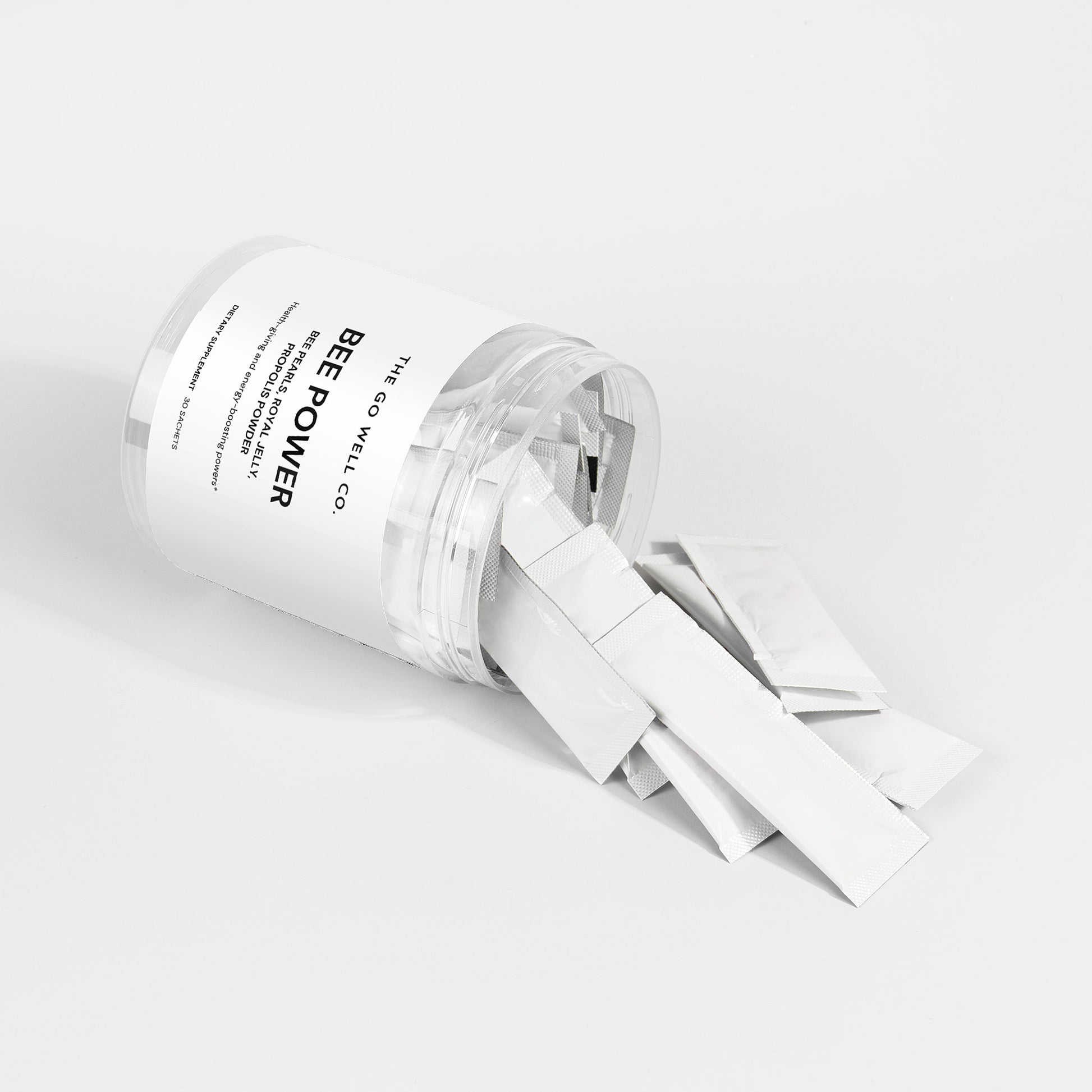 Clear container with white strap labeled 'Bee Power' on a light gray background
