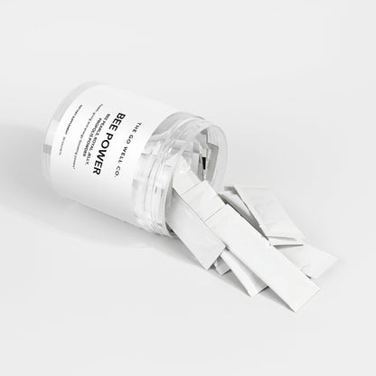 Clear container with white strap labeled 'Bee Power' on a light gray background