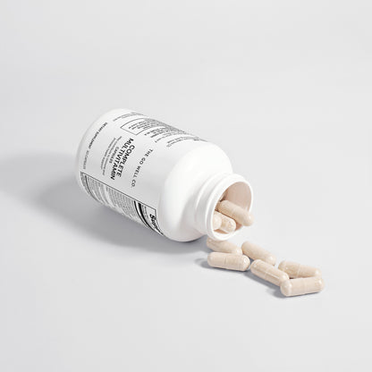 Bottle of multivitamin capsules by The Go Well Co.