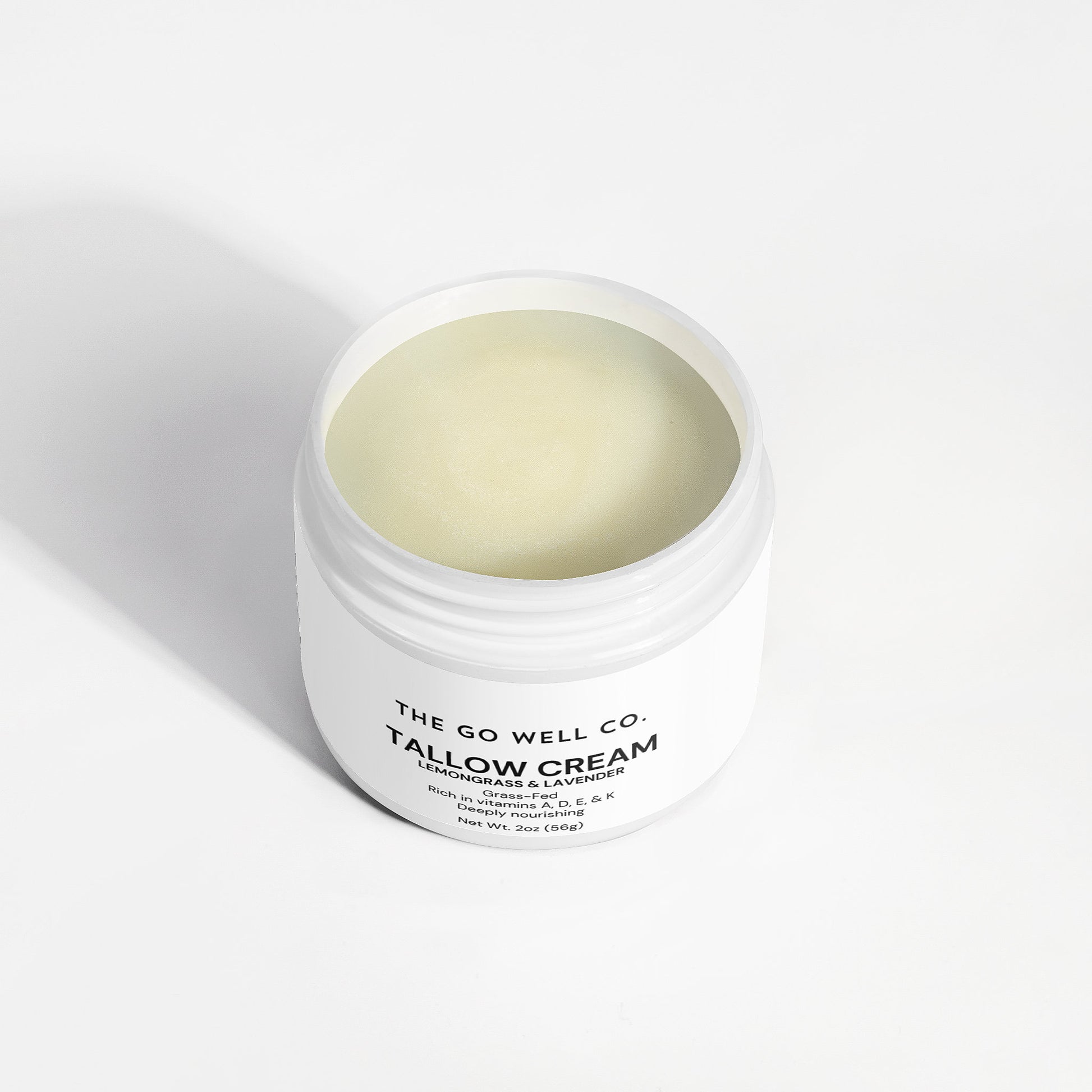 White jar of Tallow Cream from The Go Well Co. on a white background
