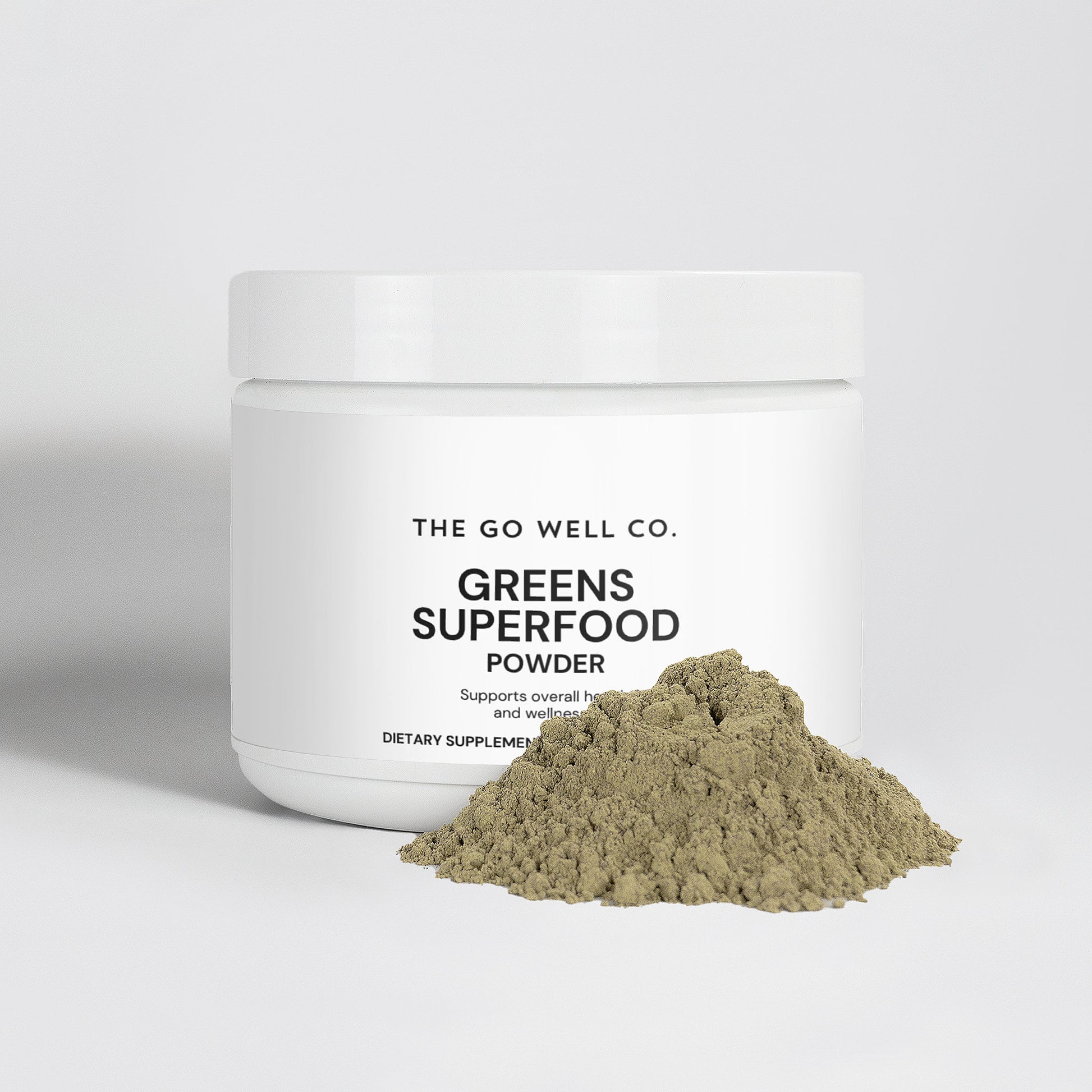 Jar of Greens Superfood Powder from The Go Well Co. on a white background