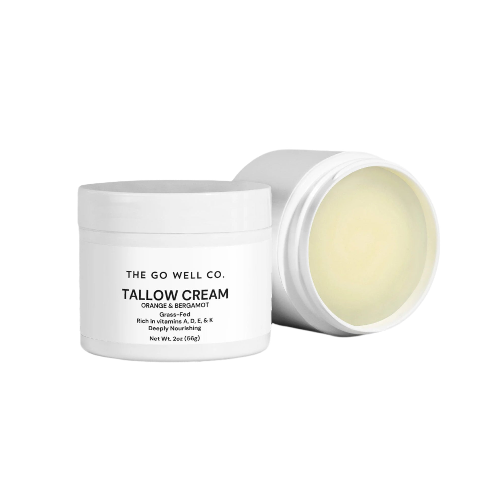 Tallow cream jar with lid open, showing cream inside, on a white background.