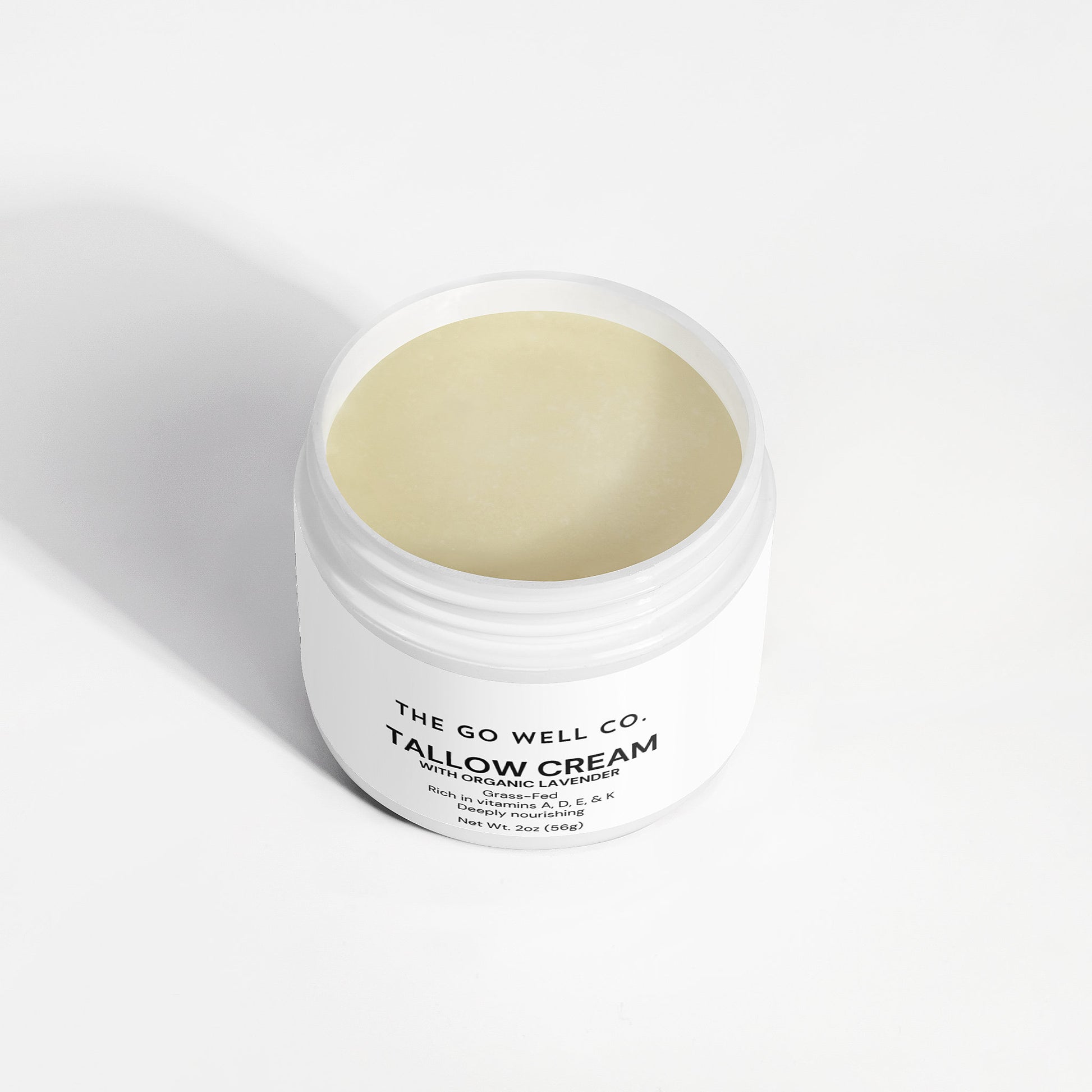 Jar of tallow cream from The Go Well Co. on a white background