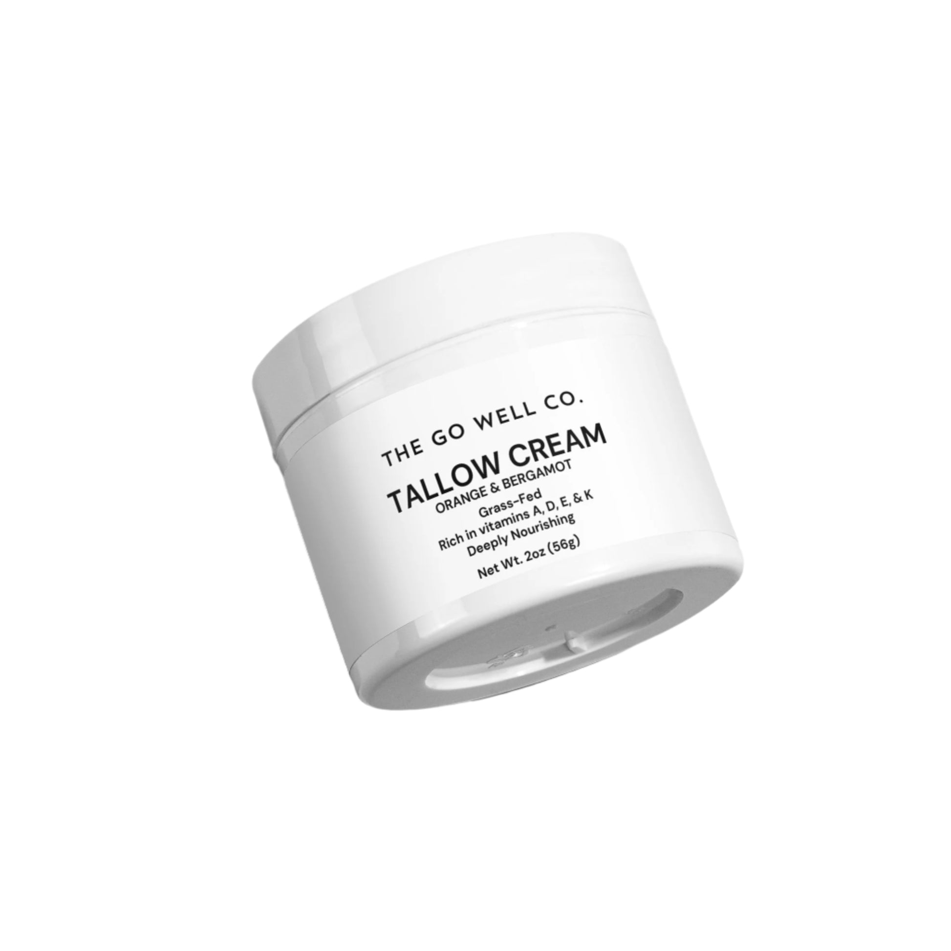 White jar of Tallow Cream from The Go Well Co. on a light gray background