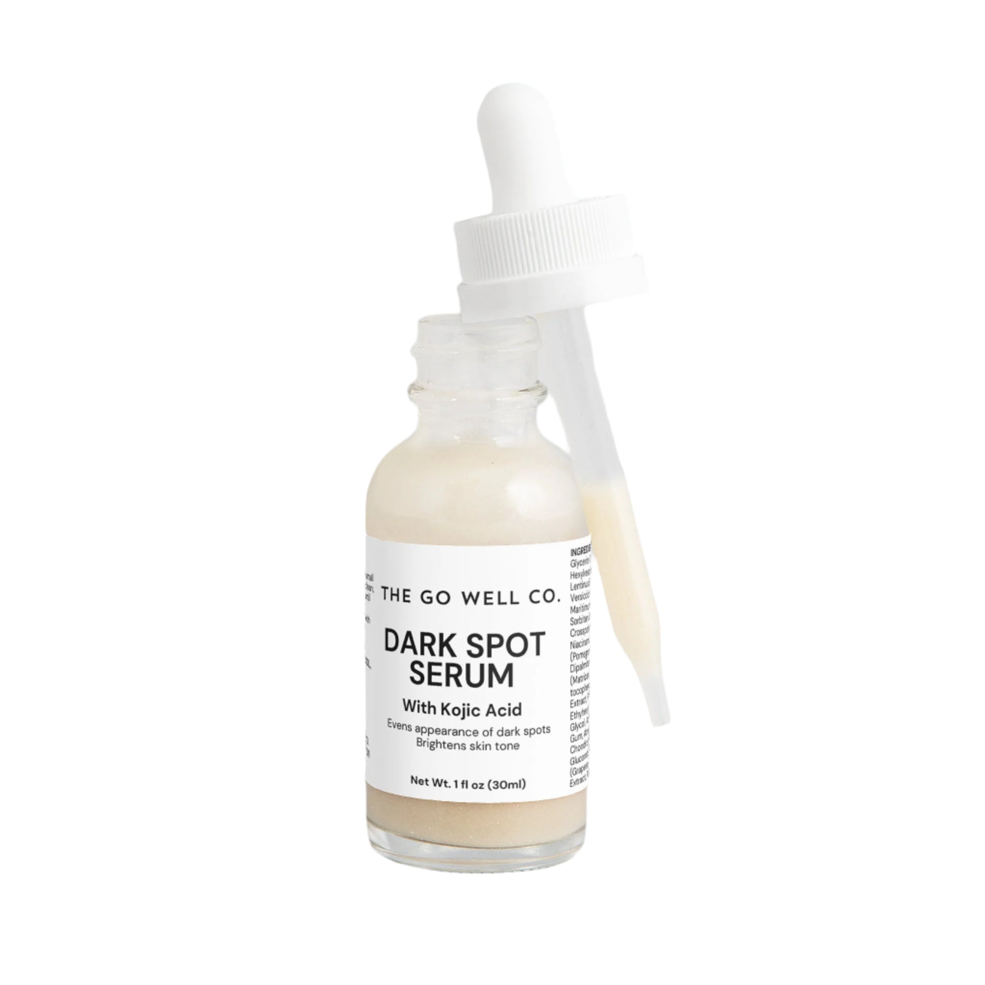 Dark spot serum bottle with dropper labeled 'The Go Well Co.' on a white background