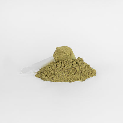Green powder on a white background