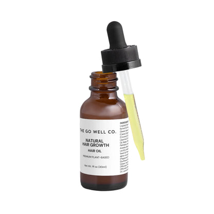 Bottle of The Go Well Co. natural hair growth hair oil with dropper on a white background