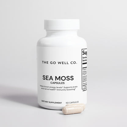 White bottle of Sea Moss capsules from The Go Well Co. on a light gray background