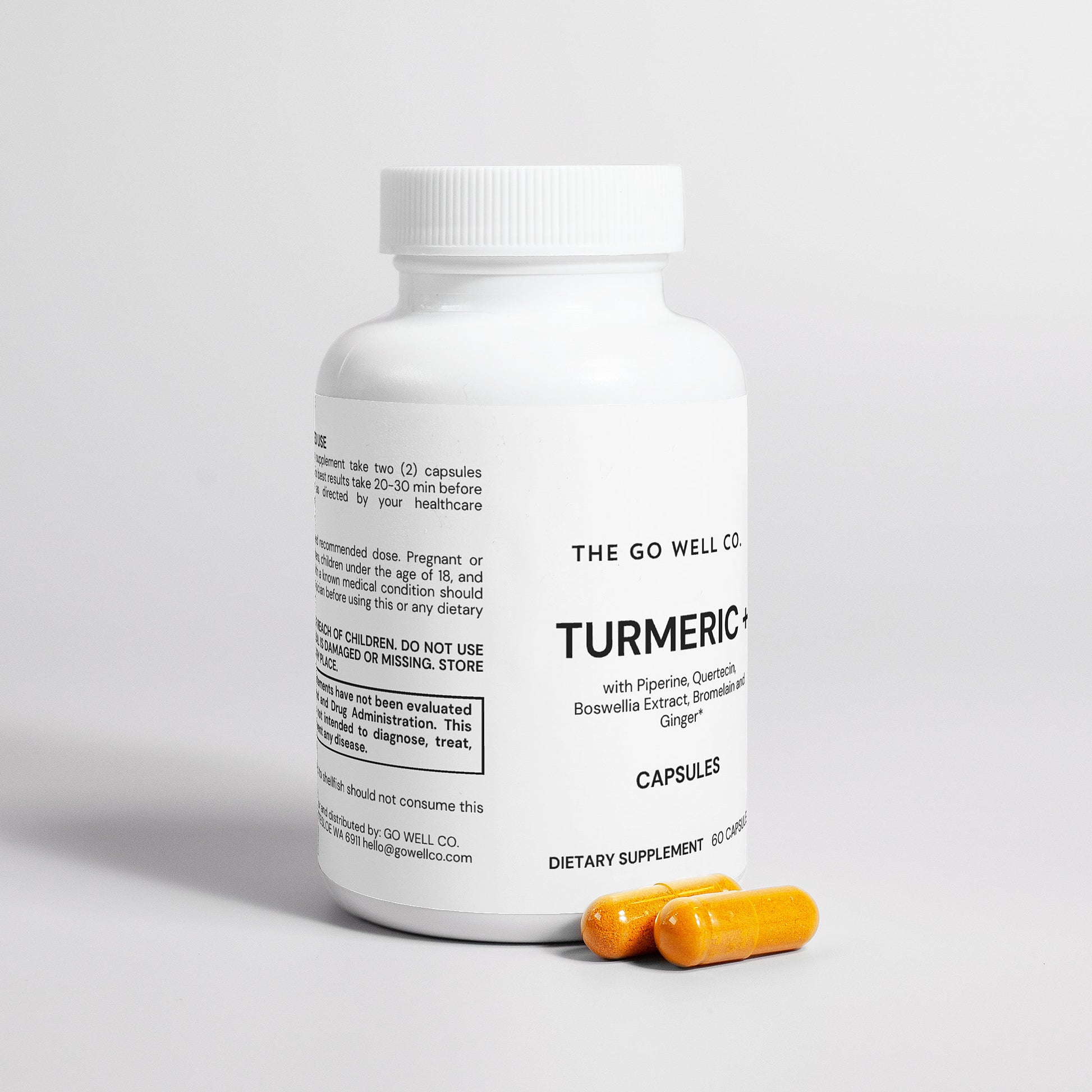 White supplement bottle labeled 'The Go Well Co. Turmeric Capsules' with yellow capsules on a light gray background