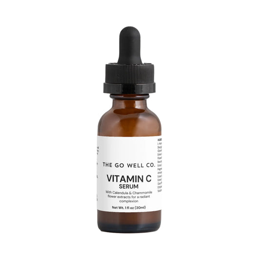 Vitamin C serum bottle with dropper labeled 'The Go Well Co.' on a white background